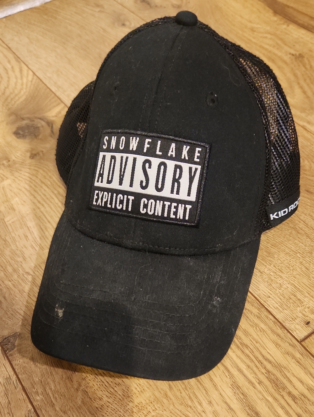Snowflake Advisory Explicit Content Black Mesh Trucker Hat